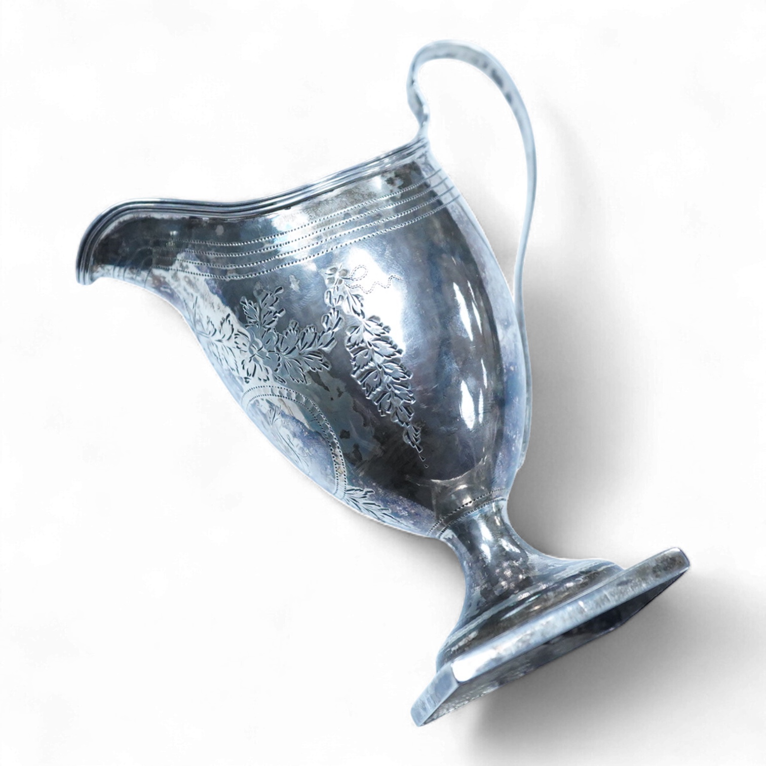 A George III silver helmet shaped cream jug, by Stephen Adams II, London, 1799, 12.8cm, 87 grams.